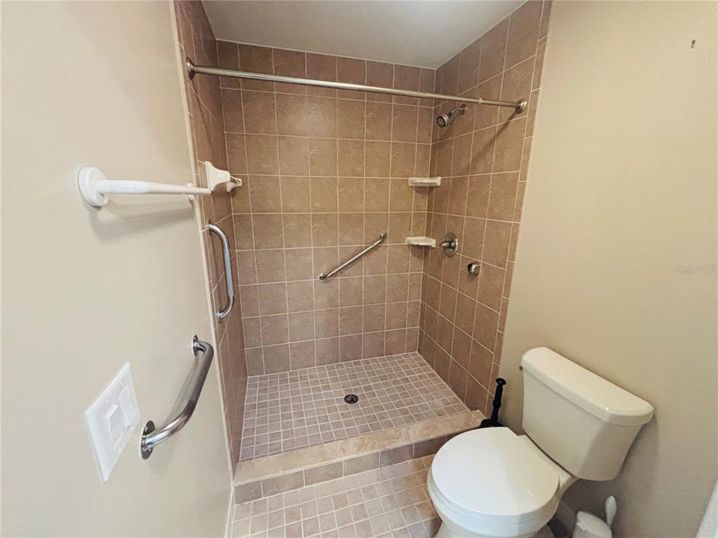 177 North Golf Harbor Path Inverness, FL 34450 - Photo 12 of 27 a bathroom with a toilet and shower