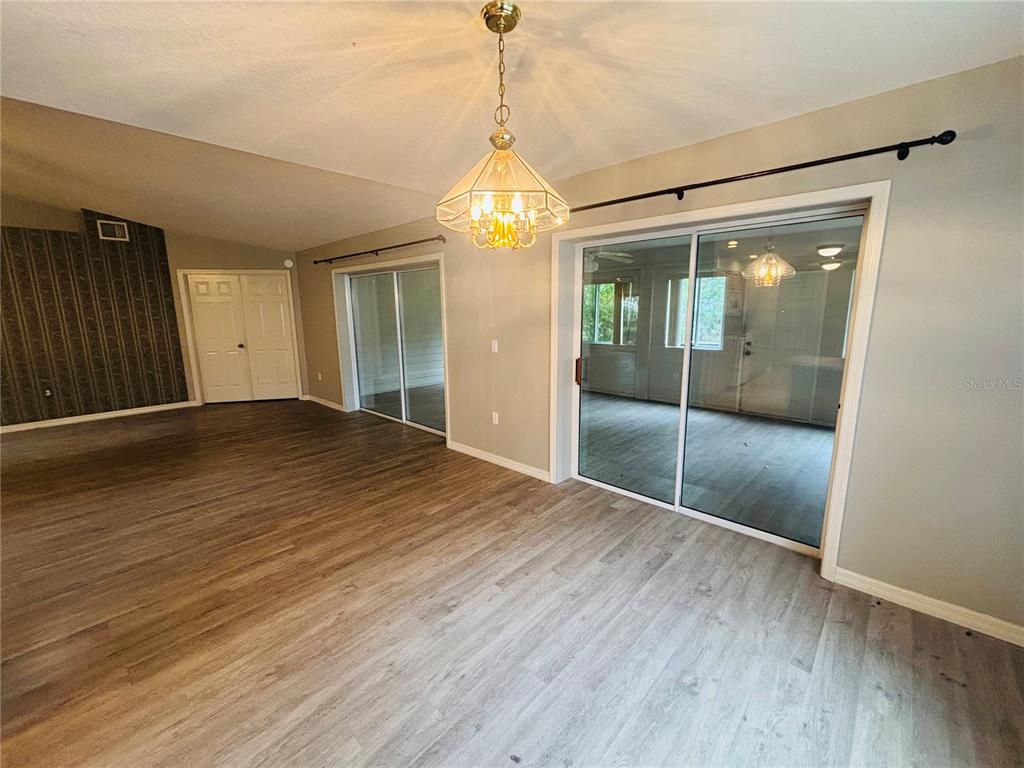177 North Golf Harbor Path Inverness, FL 34450 - Photo 24 of 27 a view of an empty room with wooden floor and a window