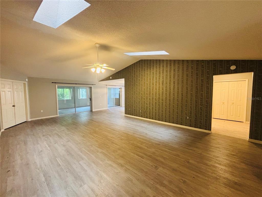 177 North Golf Harbor Path Inverness, FL 34450 - Photo 4 of 27 a view of an empty room with wooden floor and a window