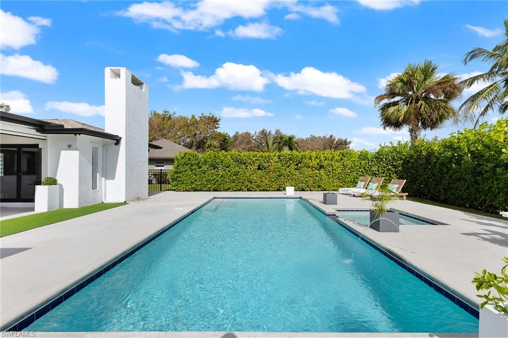 70 Thorncrest Lane Naples, FL 34113 - Photo 45 of 50 a view of a terrace with a garden