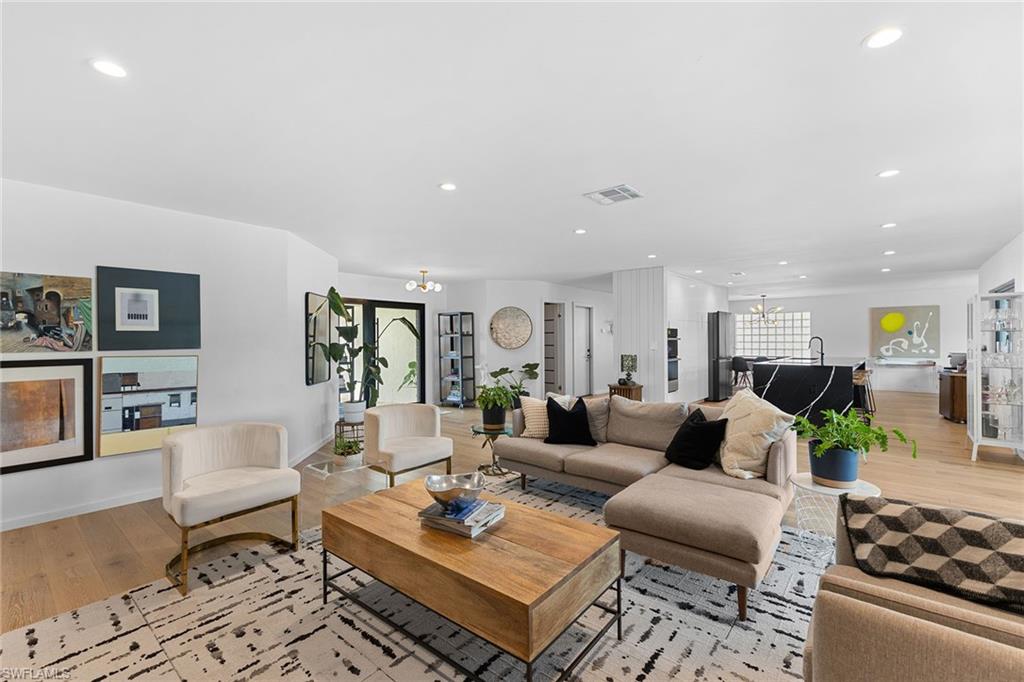70 Thorncrest Lane Naples, FL 34113 - Photo 5 of 50 a living room with furniture and wooden floor