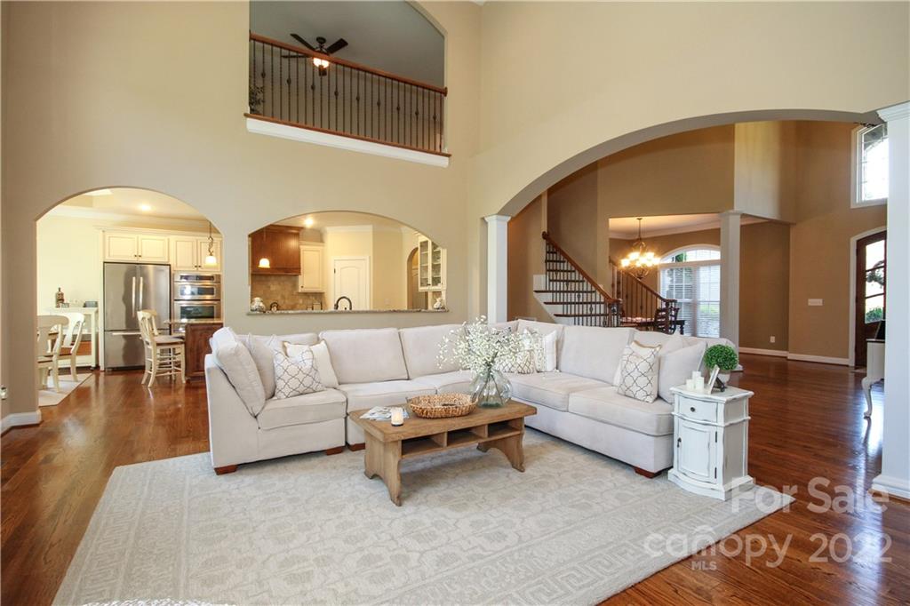 159 Abbington Place, Unit 16 Locust, NC 28097 - Photo 11 of 47 a living room with furniture and a large window