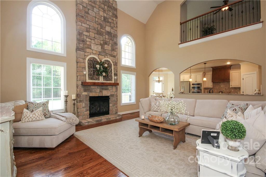 159 Abbington Place, Unit 16 Locust, NC 28097 - Photo 12 of 47 a living room with furniture and a fireplace