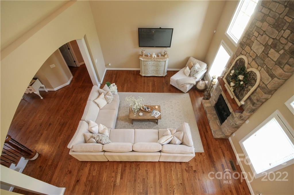159 Abbington Place, Unit 16 Locust, NC 28097 - Photo 13 of 47 a living room with furniture and a fireplace