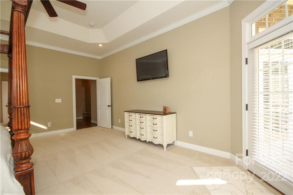159 Abbington Place, Unit 16 Locust, NC 28097 - Photo 20 of 47 a view of a livingroom with an empty space and a window