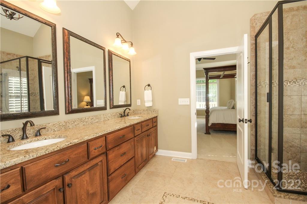 159 Abbington Place, Unit 16 Locust, NC 28097 - Photo 21 of 47 a bathroom with a granite countertop sink mirror and a