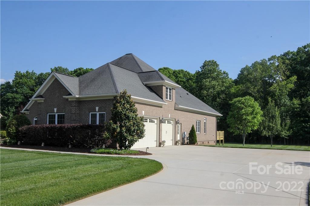 159 Abbington Place, Unit 16 Locust, NC 28097 - Photo 39 of 47 front view of house with a yard