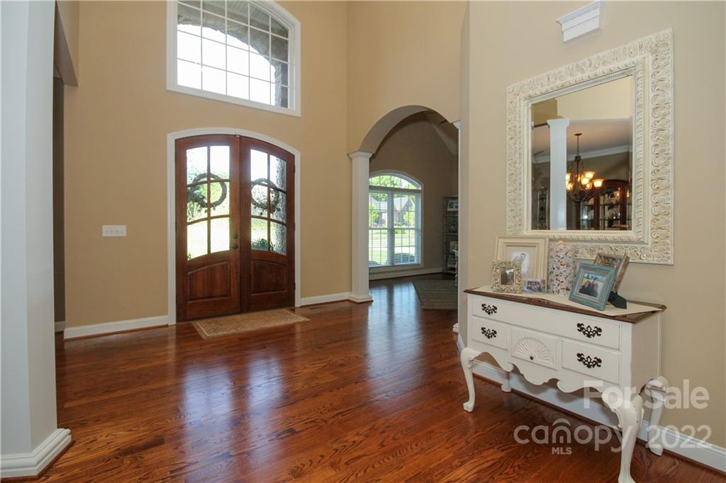 159 Abbington Place, Unit 16 Locust, NC 28097 - Photo 5 of 47 wooden floor in an entryway with a window