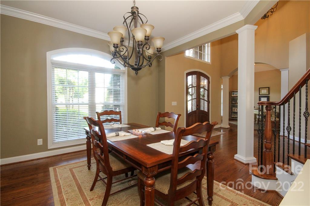 159 Abbington Place, Unit 16 Locust, NC 28097 - Photo 7 of 47 a view of a dining room with furniture window and wooden floor
