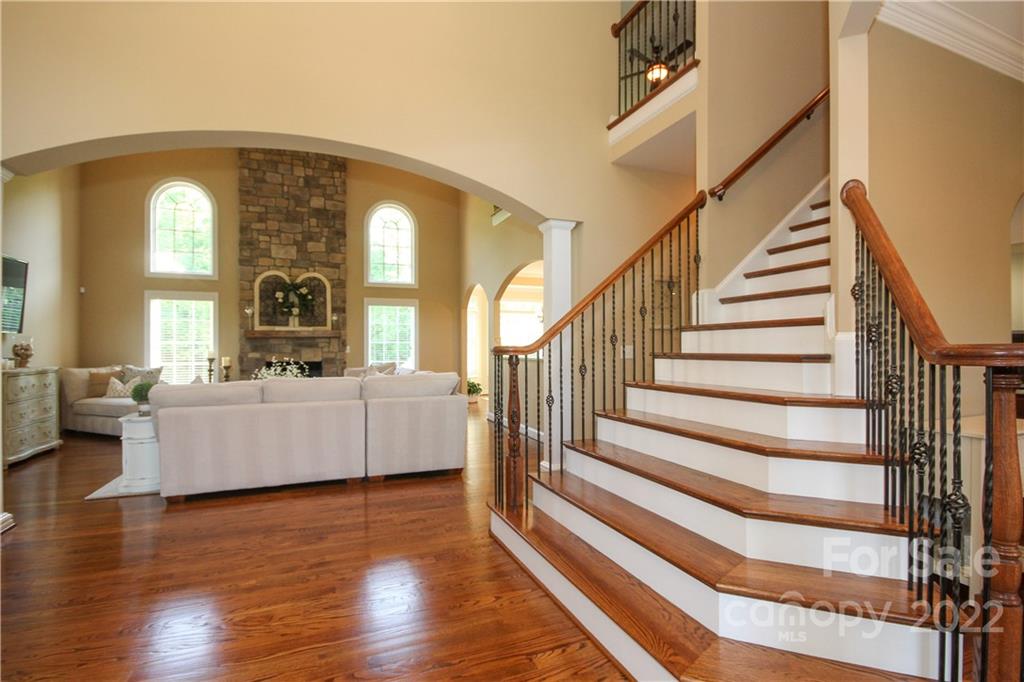 159 Abbington Place, Unit 16 Locust, NC 28097 - Photo 10 of 47 a view of entryway and hall with wooden floor