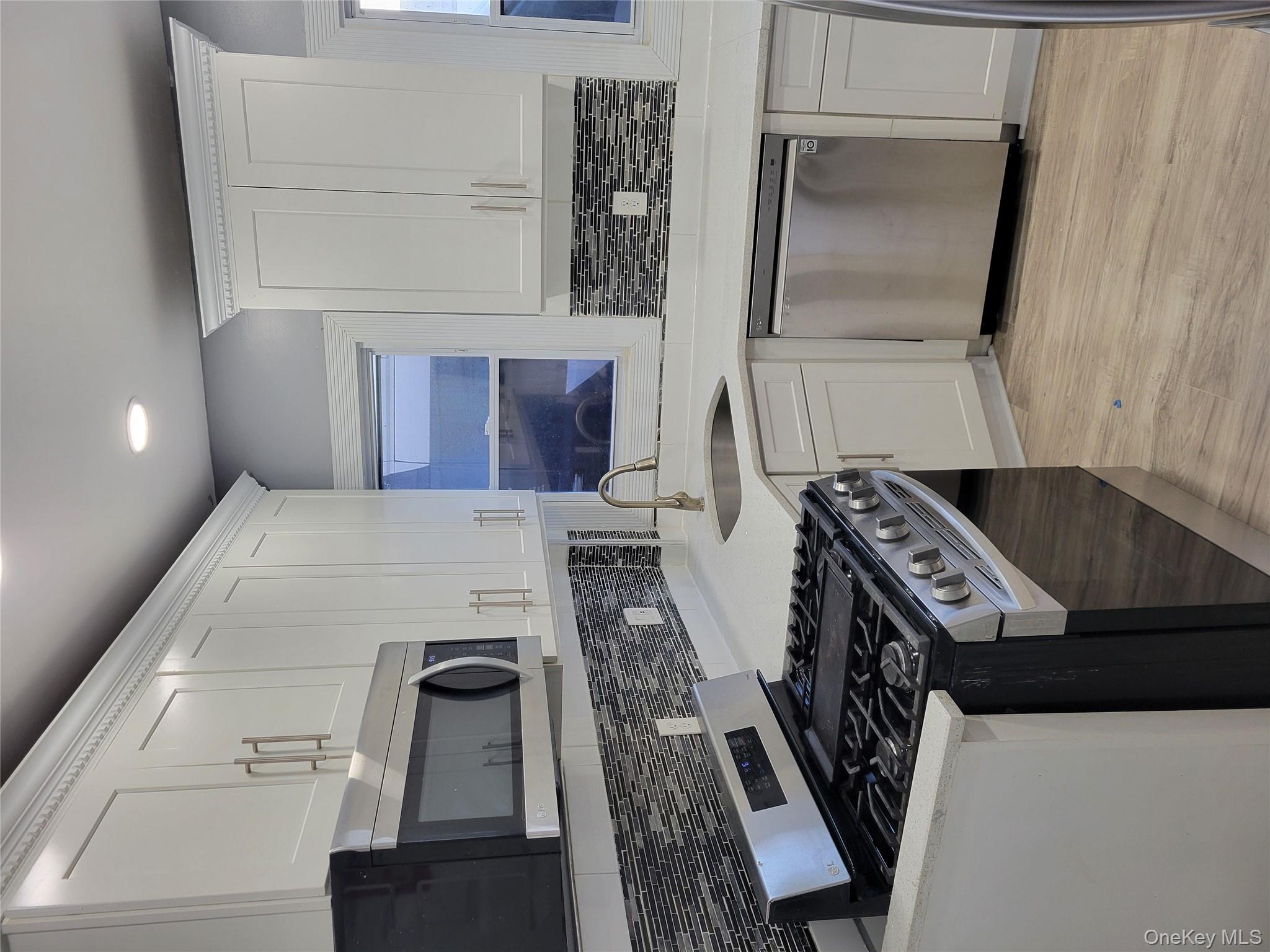 871 Throgs Neck Expressway, Unit 1 Bronx, NY 10465 - Photo 10 of 19 Kitchen with granite countertops and dishwasher