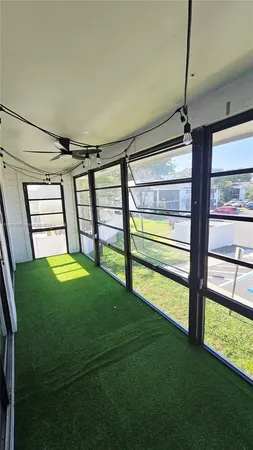 a view of empty room with floor to ceiling window