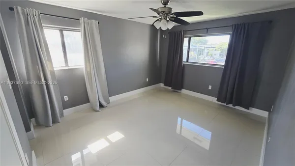 a view of an empty room and window