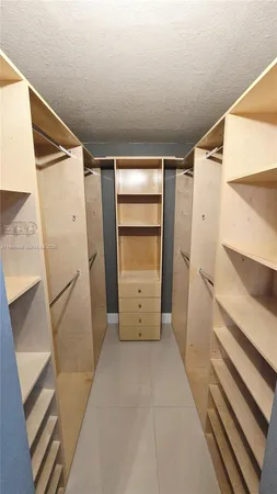 a view of an empty walk in closet