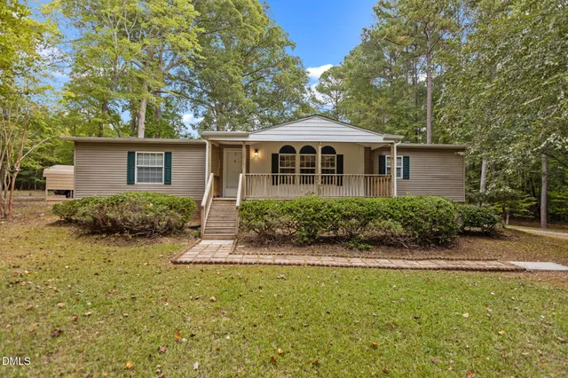front view of a house with a yard