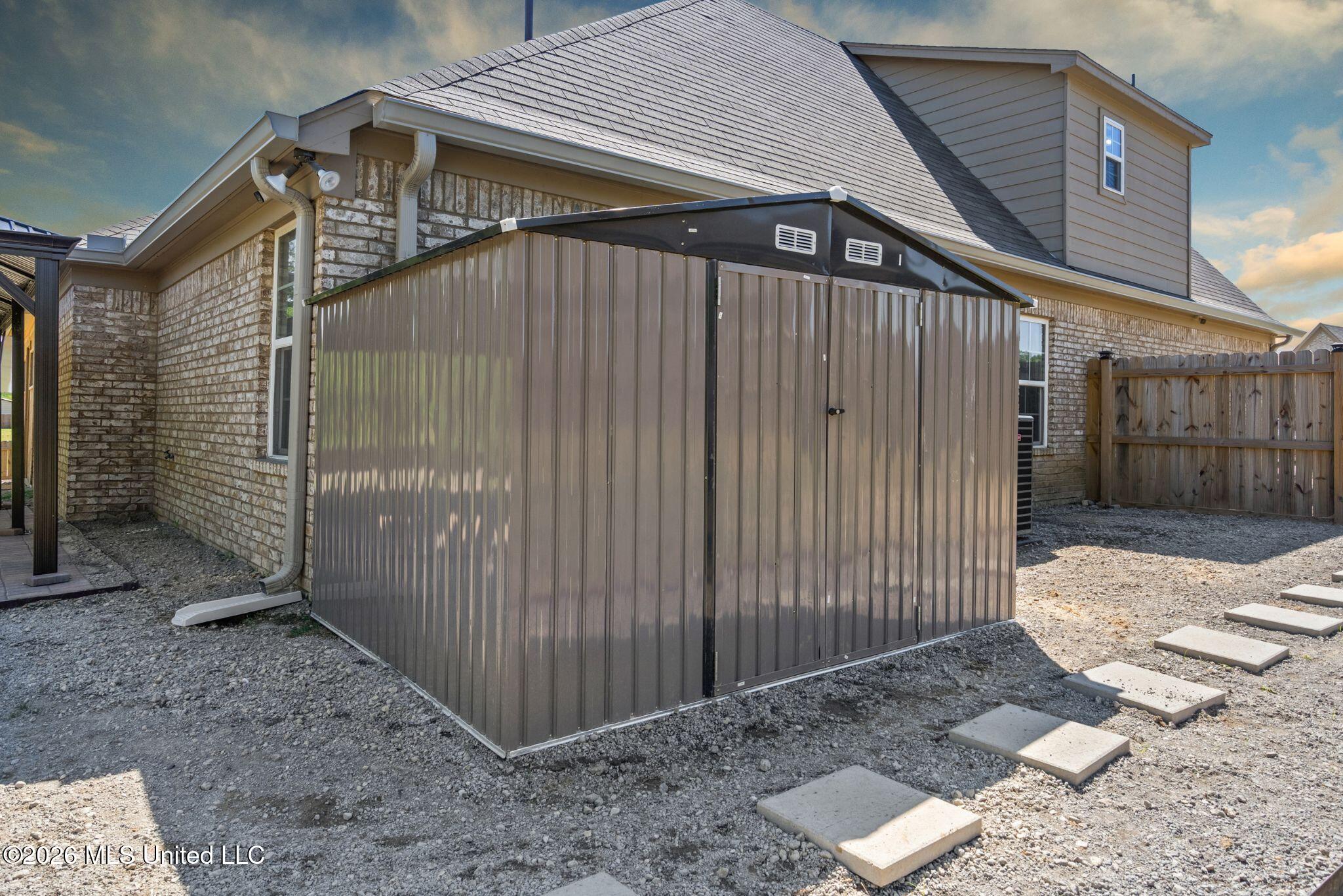 7616 Ridgefield Drive Horn Lake, MS 38637 - Photo 23 of 26 24-Shed Dramatic Sky