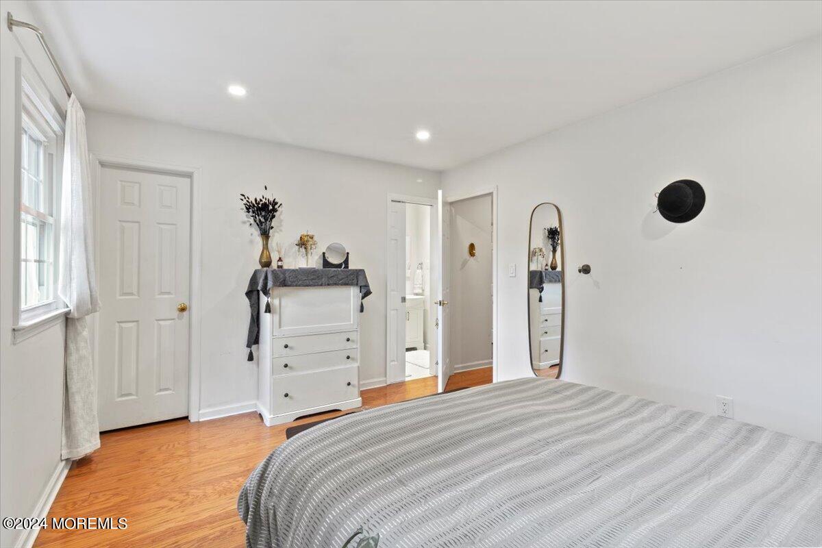 3 Moak Drive Hazlet, NJ 07730 - Photo 13 of 27 a bedroom with a bed and cabinets
