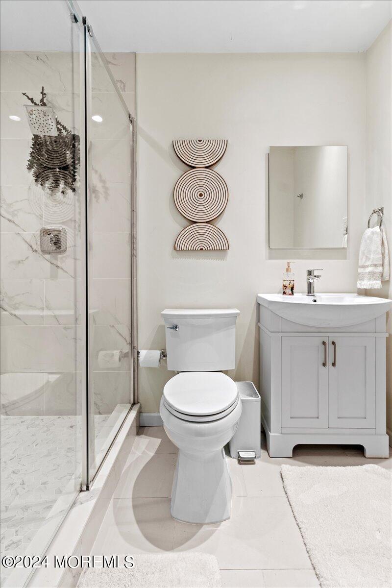 3 Moak Drive Hazlet, NJ 07730 - Photo 14 of 27 a bathroom with a toilet sink and shower