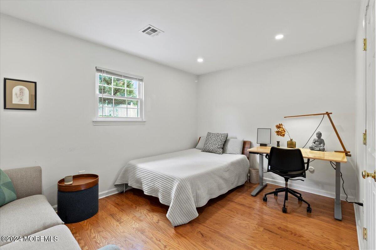 3 Moak Drive Hazlet, NJ 07730 - Photo 16 of 27 a bedroom with a bed and wooden floor