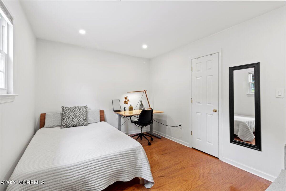 3 Moak Drive Hazlet, NJ 07730 - Photo 17 of 27 a bedroom with a bed and a mirror