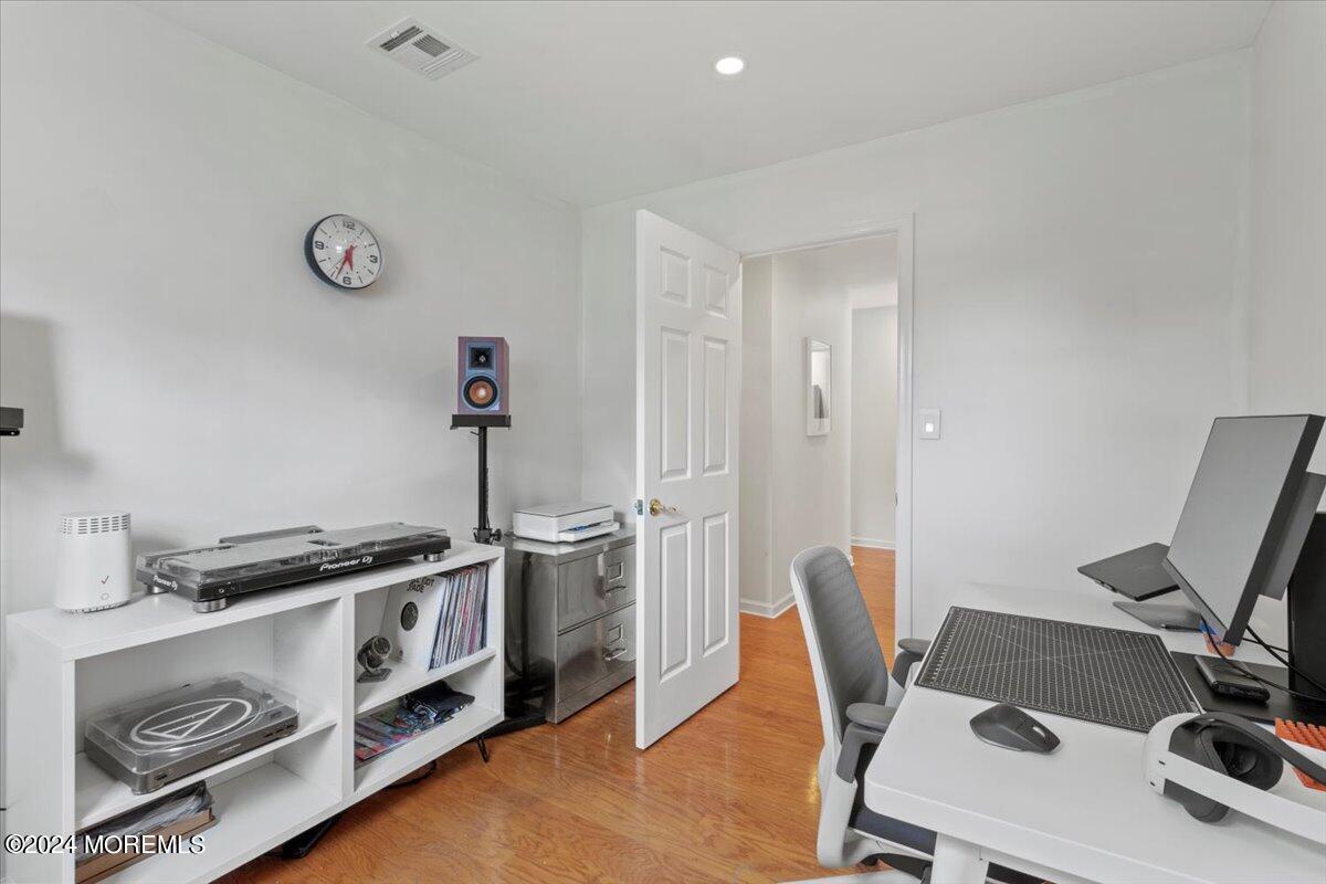 3 Moak Drive Hazlet, NJ 07730 - Photo 19 of 27 a view of a workspace with furniture and wooden floor