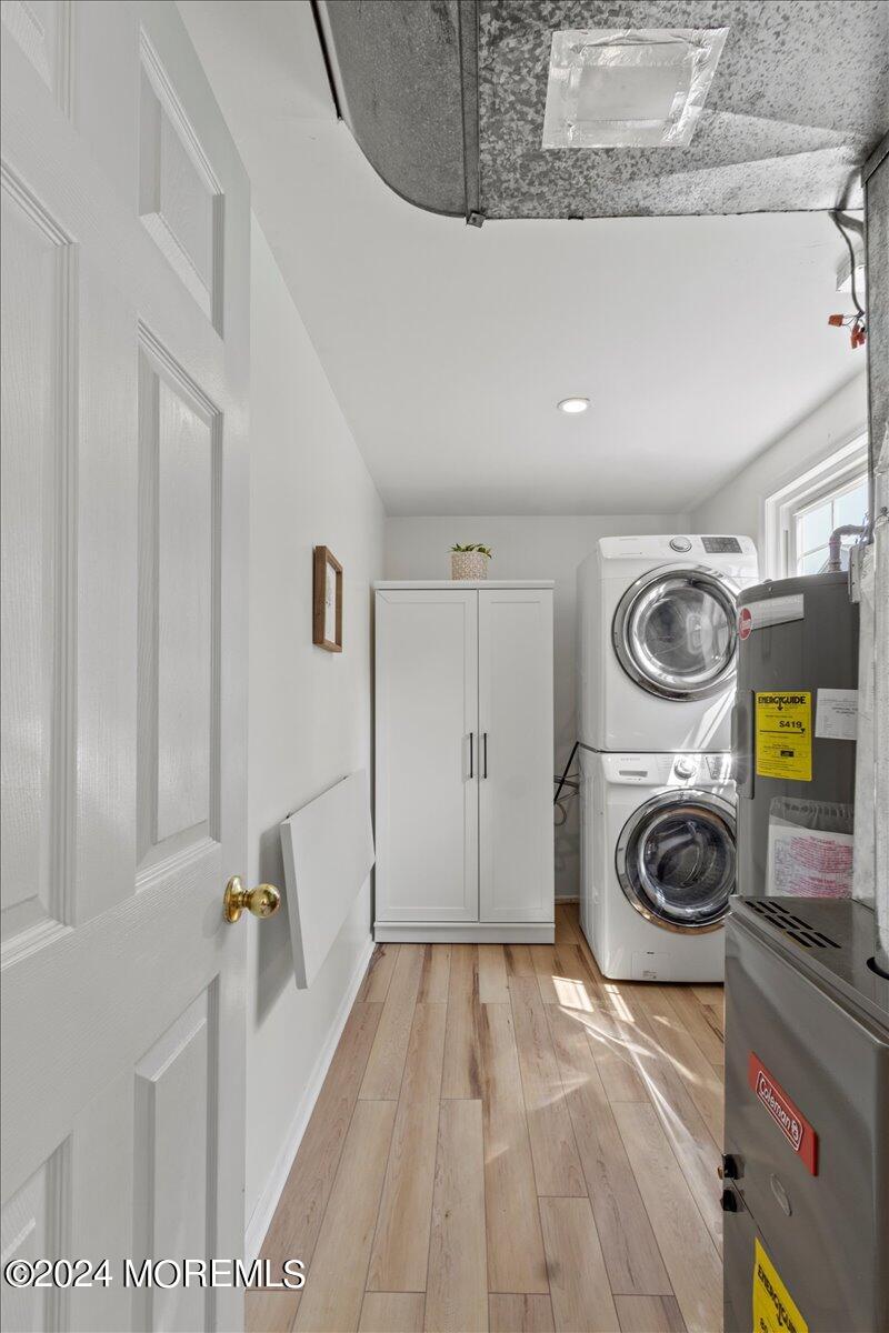 3 Moak Drive Hazlet, NJ 07730 - Photo 22 of 27 a view of washer and dryer with bathroom in the background