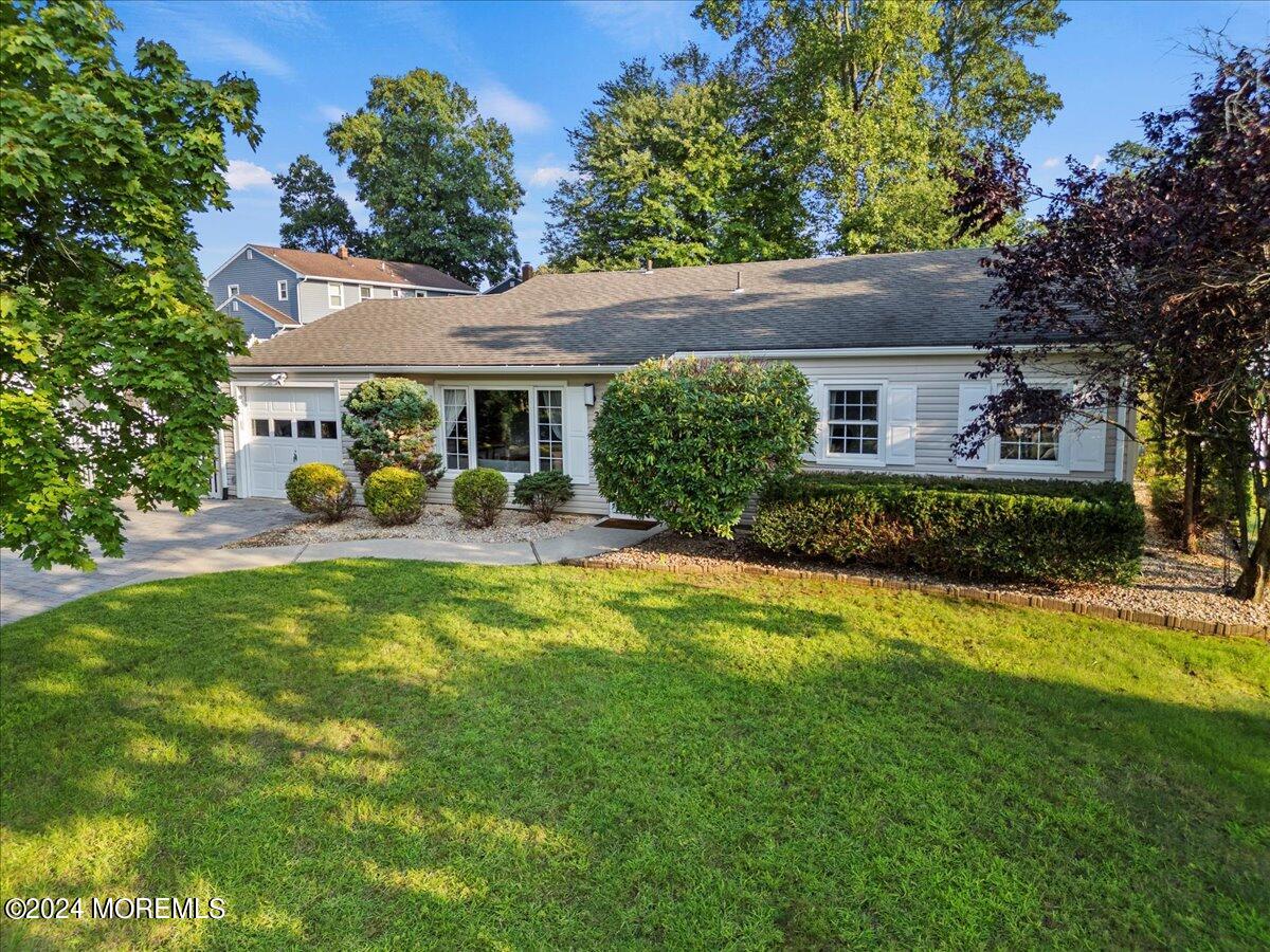 3 Moak Drive Hazlet, NJ 07730 - Photo 24 of 27 a front view of a house with garden