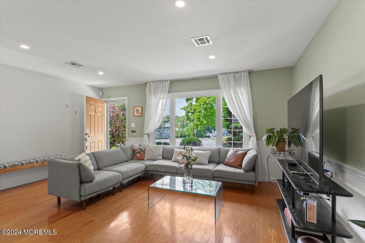 3 Moak Drive Hazlet, NJ 07730 - Photo 5 of 27 a living room with furniture flat screen tv and a large window