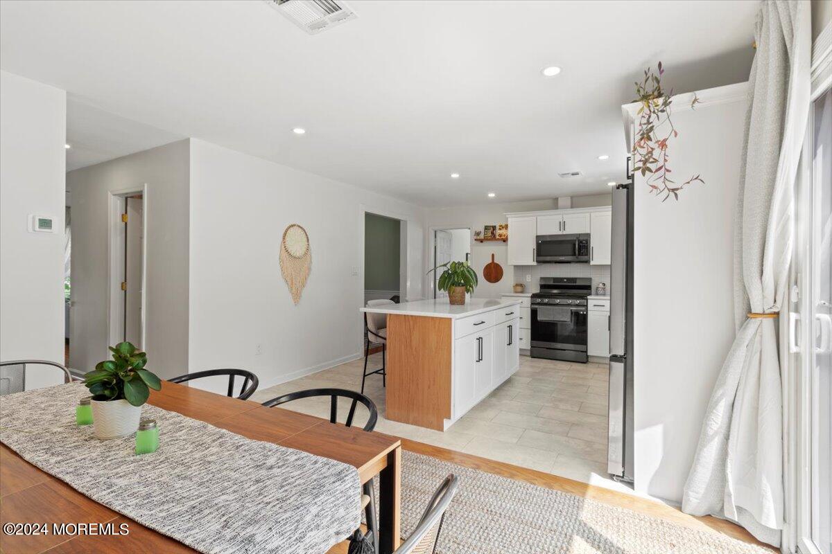 3 Moak Drive Hazlet, NJ 07730 - Photo 10 of 27 a kitchen with granite countertop a refrigerator and a sink