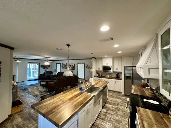a bathroom with a sink toilet and mirror