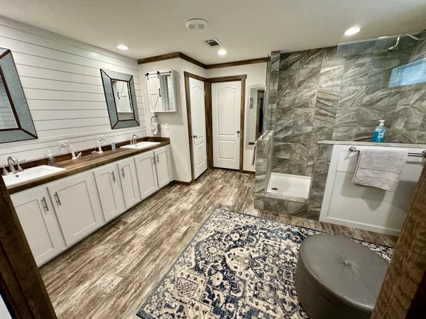 a kitchen with stainless steel appliances granite countertop a stove and a sink