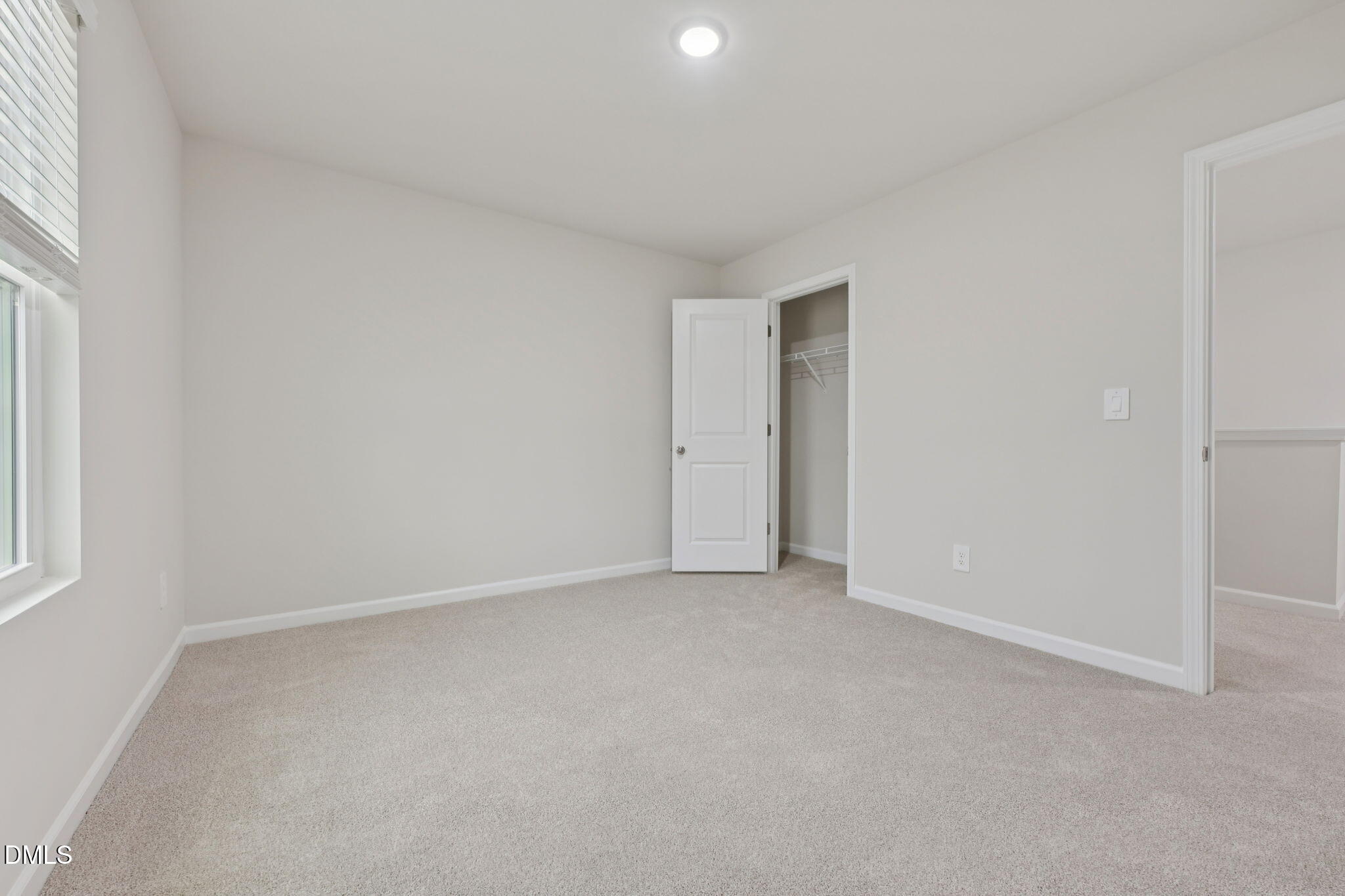 2147 Topsail Road Durham, NC 27703 - Photo 25 of 31 an empty room with a natural light