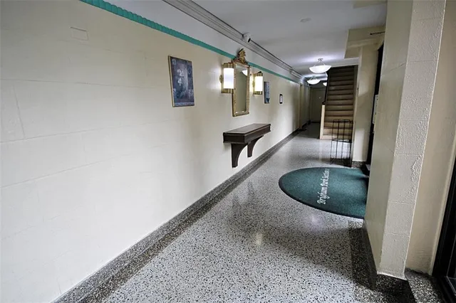 a view of a hallway with stairs