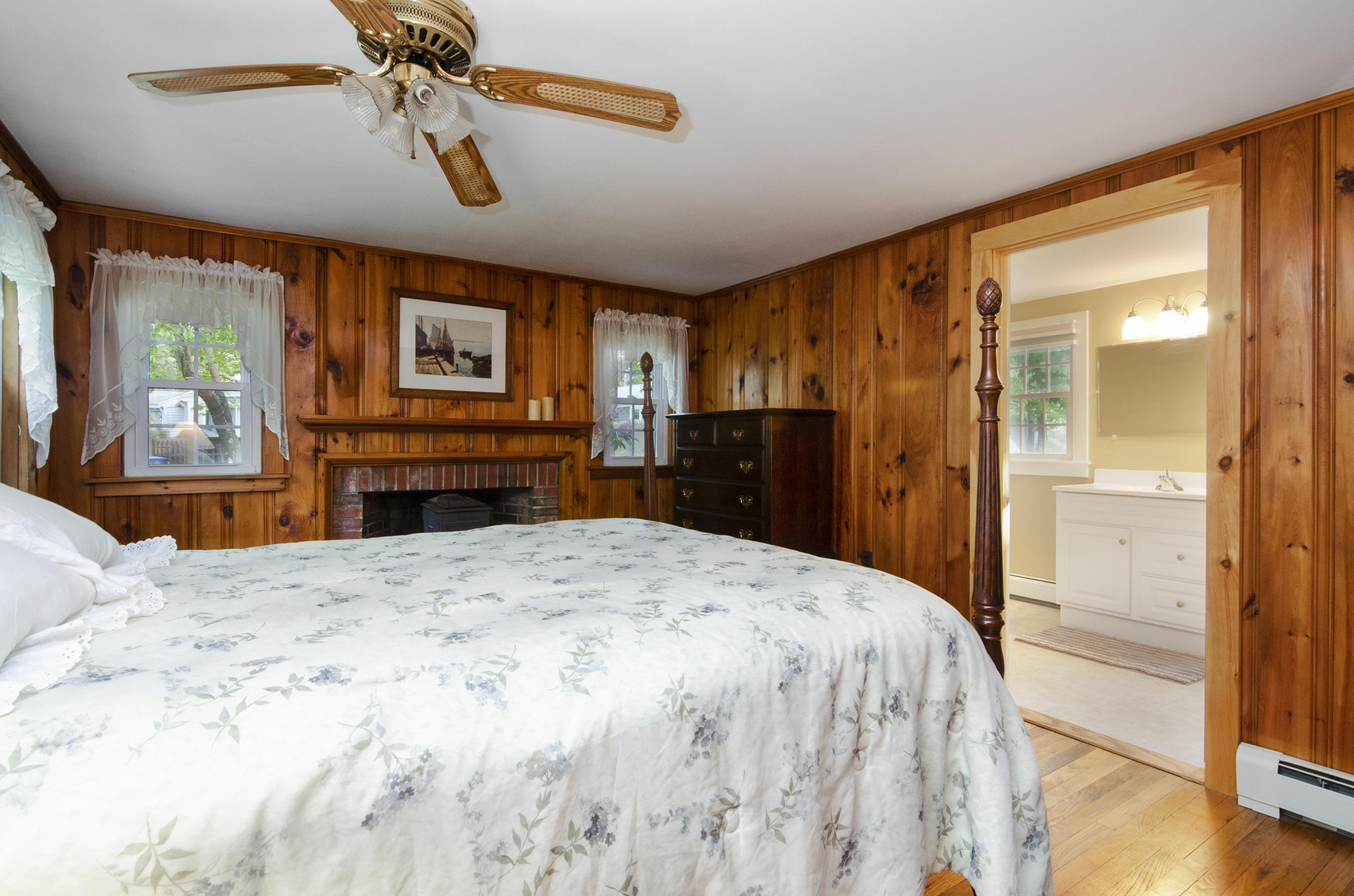 23 Skippers Way Brewster, MA 02631 - Photo 12 of 27 a spacious bedroom with a bed and a dresser