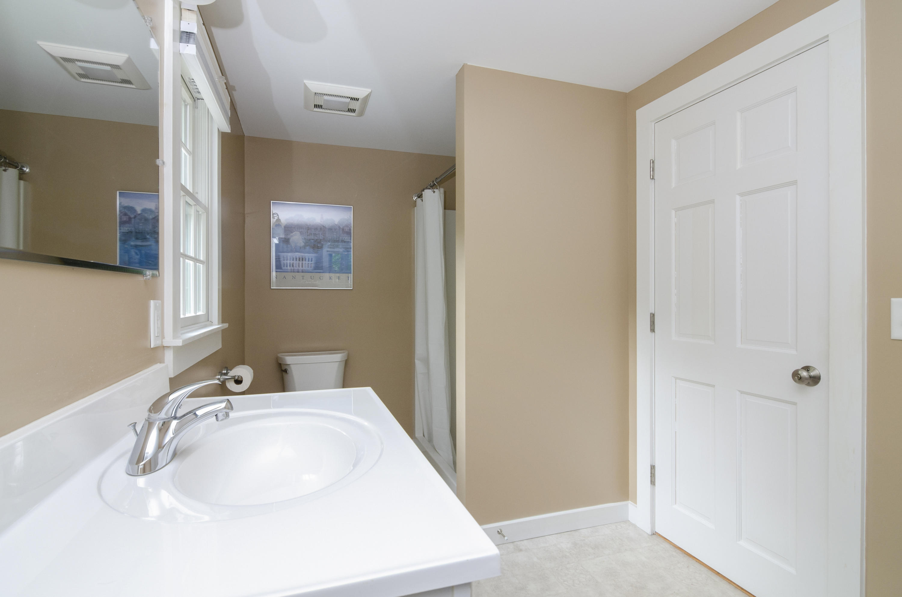 23 Skippers Way Brewster, MA 02631 - Photo 13 of 27 a bathroom with a sink and a mirror