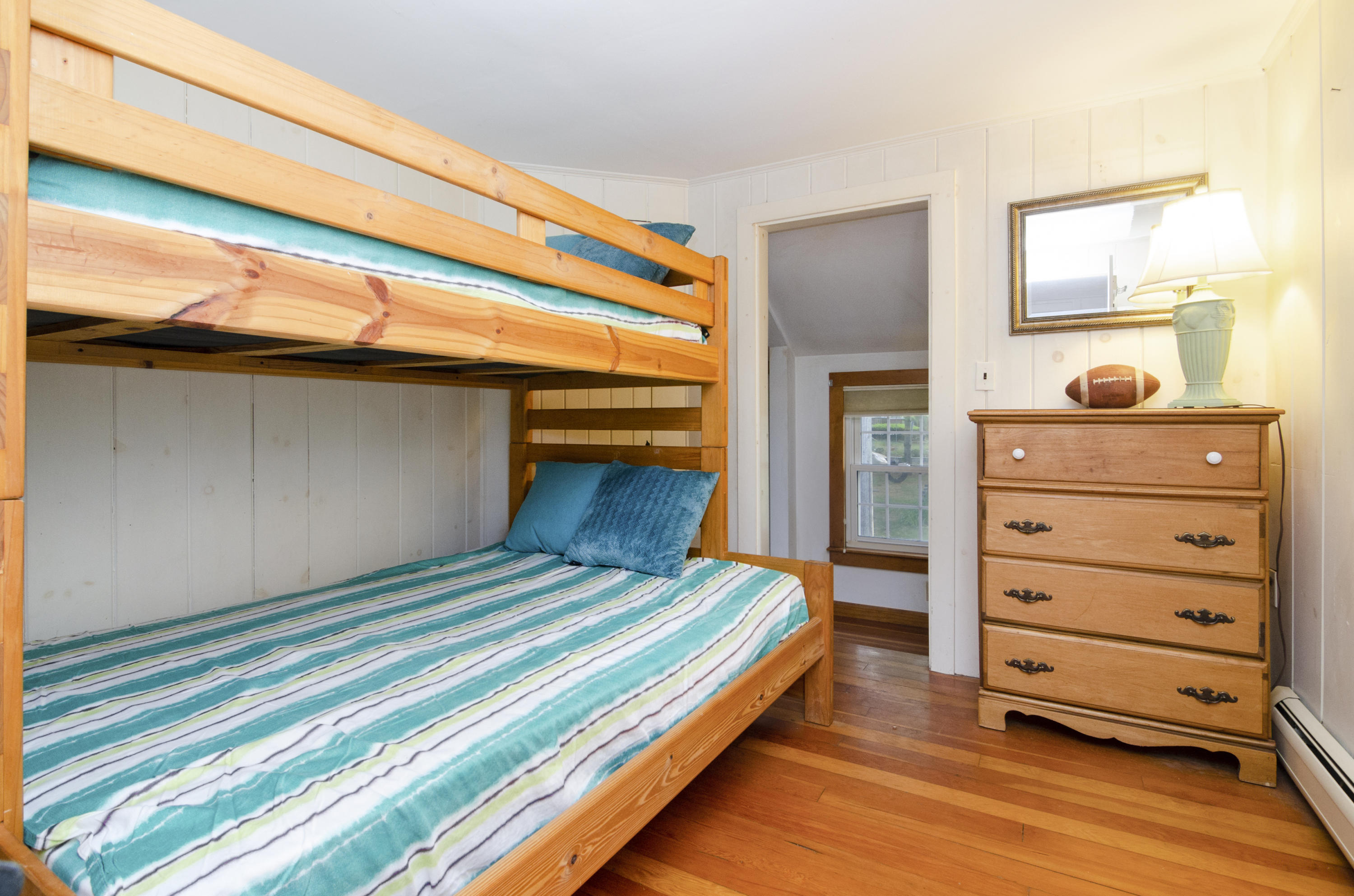 23 Skippers Way Brewster, MA 02631 - Photo 15 of 27 a bedroom with a bed and a dresser