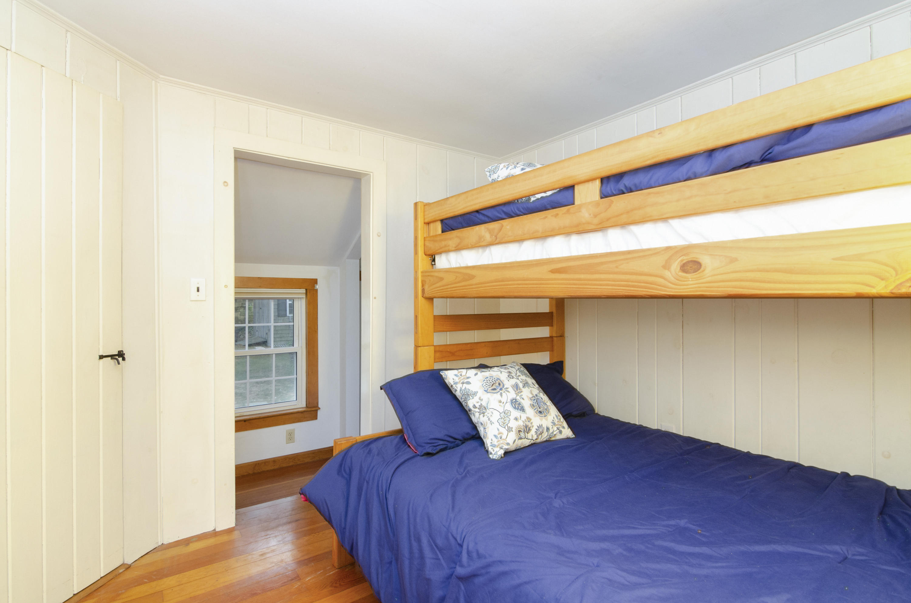 23 Skippers Way Brewster, MA 02631 - Photo 16 of 27 a bed sitting in a bedroom next to a window