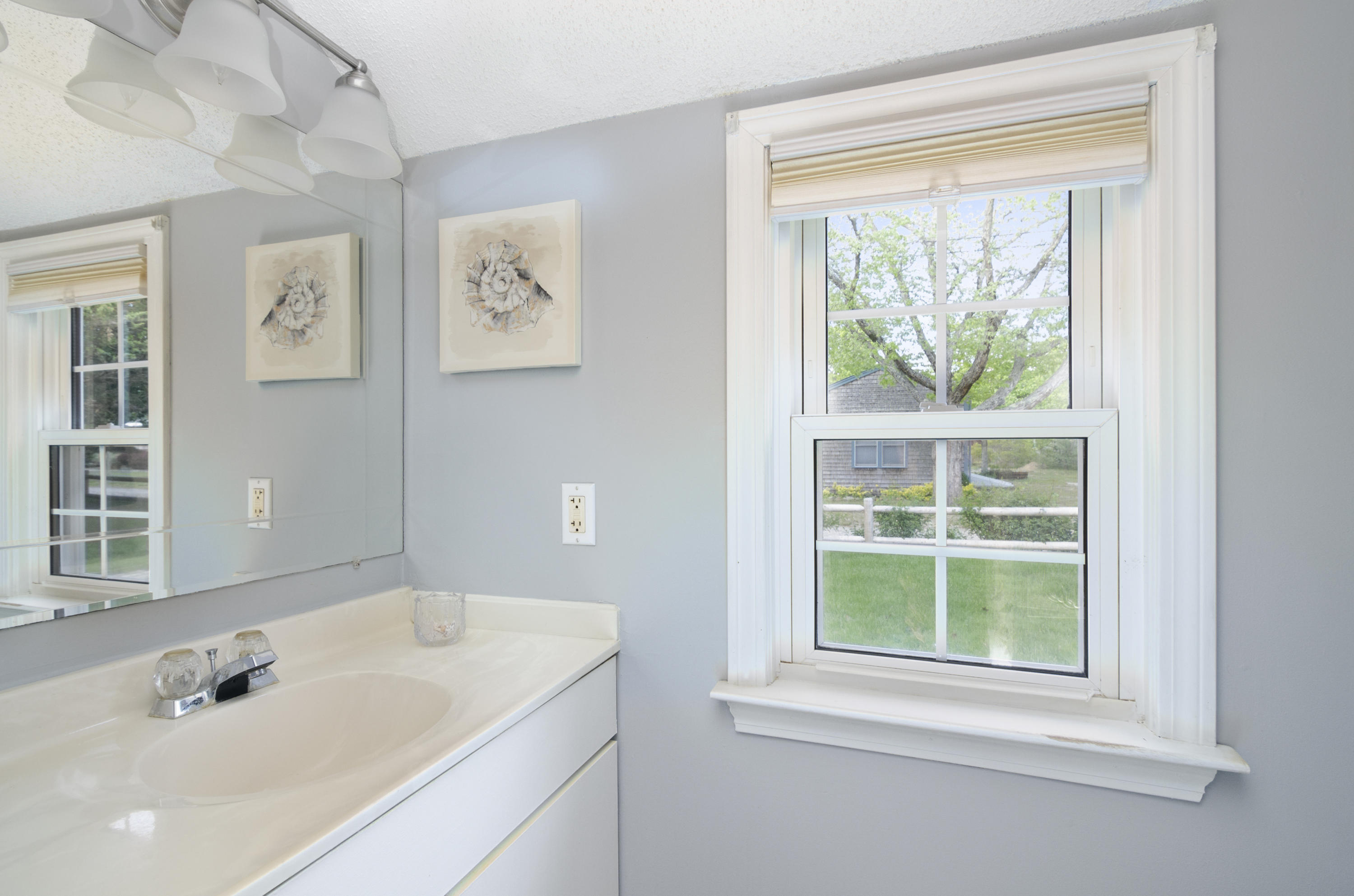23 Skippers Way Brewster, MA 02631 - Photo 17 of 27 a bathroom with a sink and a window