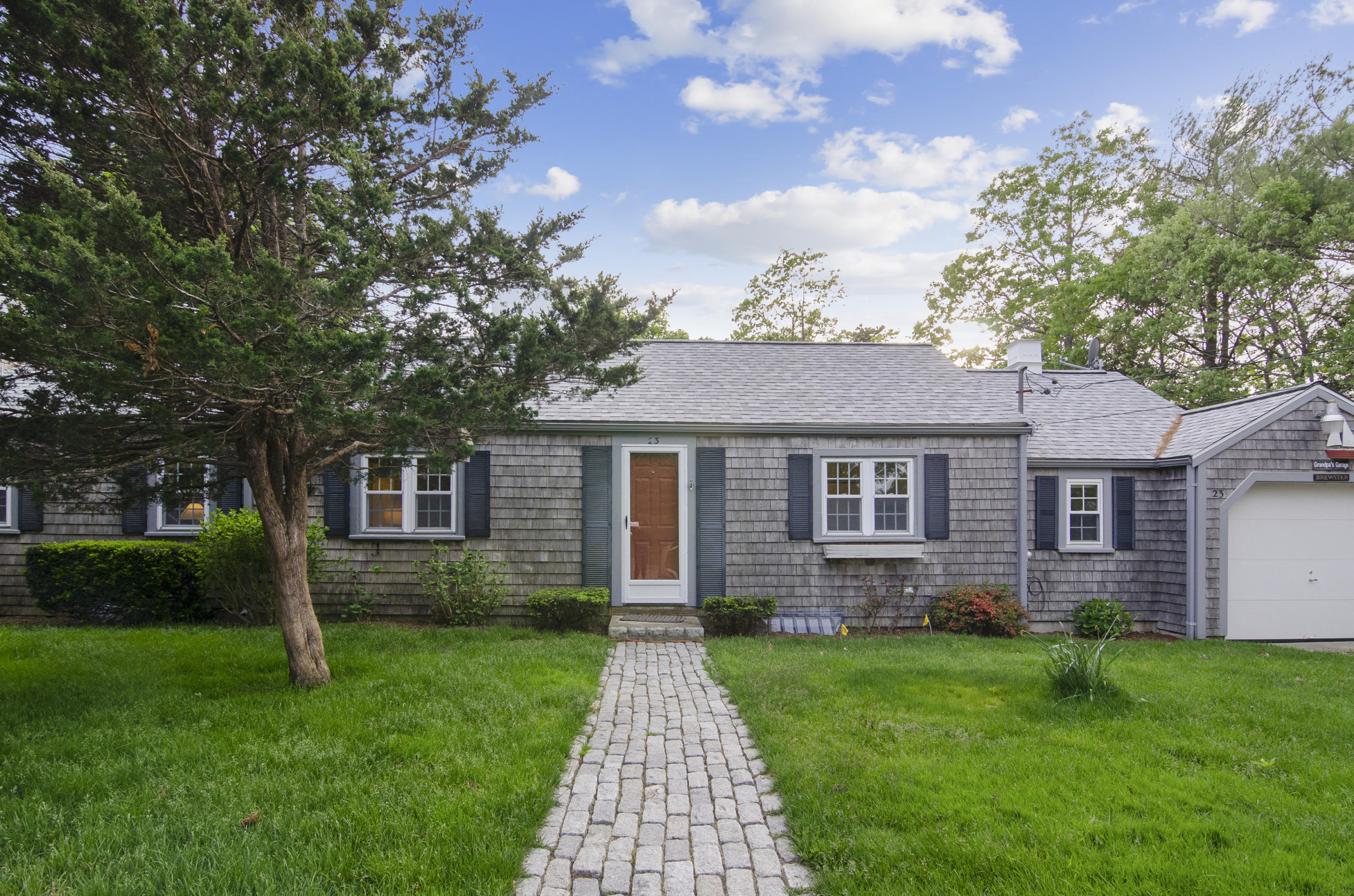 23 Skippers Way Brewster, MA 02631 - Photo 21 of 27 front view of a house with a yard