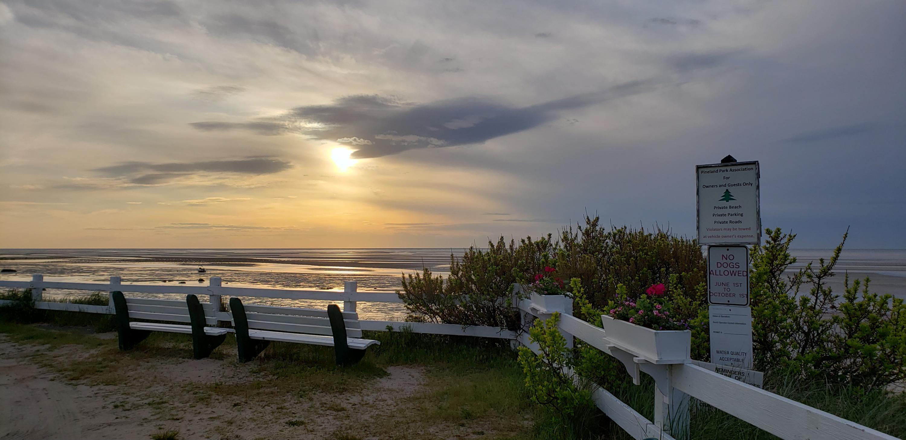23 Skippers Way Brewster, MA 02631 - Photo 24 of 27 a view of a terrace with wooden benches and bench