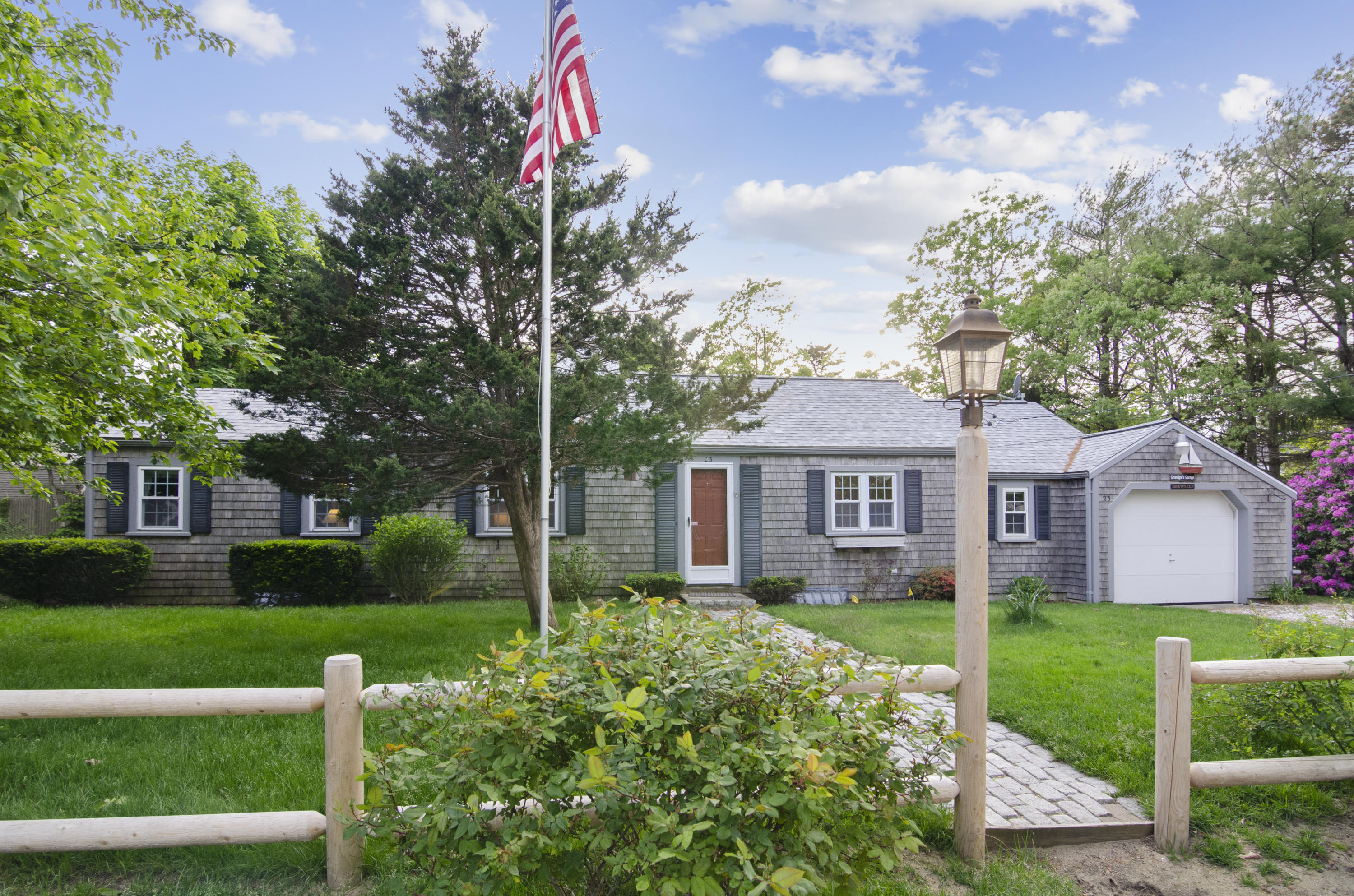 23 Skippers Way Brewster, MA 02631 - Photo 27 of 27 a front view of a house with a yard