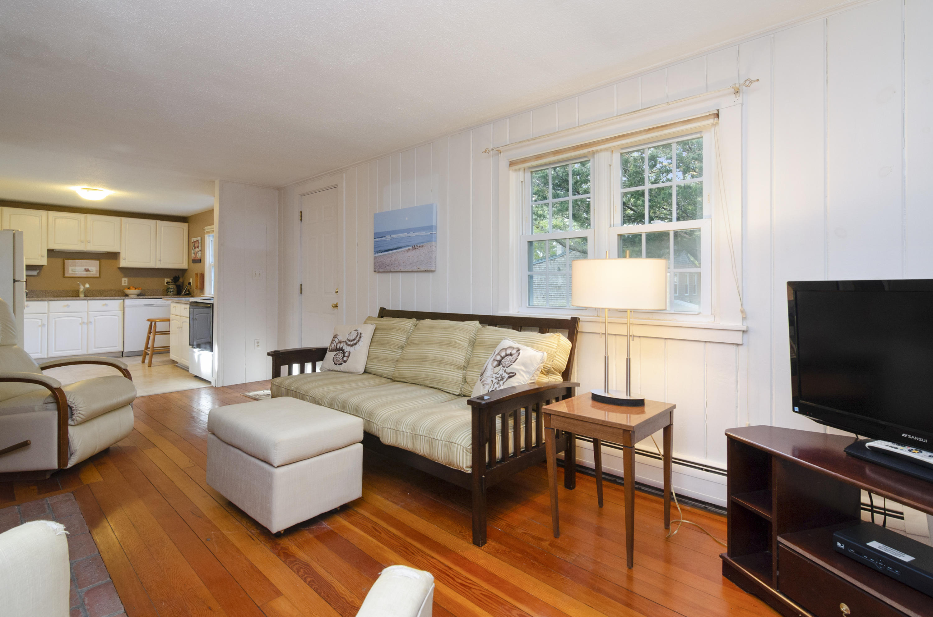23 Skippers Way Brewster, MA 02631 - Photo 4 of 27 a living room with furniture and a flat screen tv
