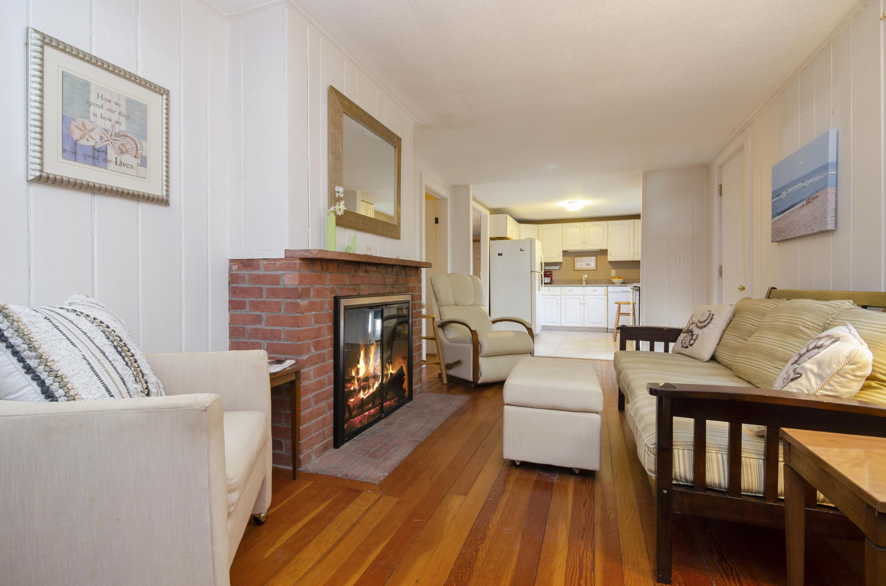 23 Skippers Way Brewster, MA 02631 - Photo 5 of 27 a living room with furniture and a fireplace