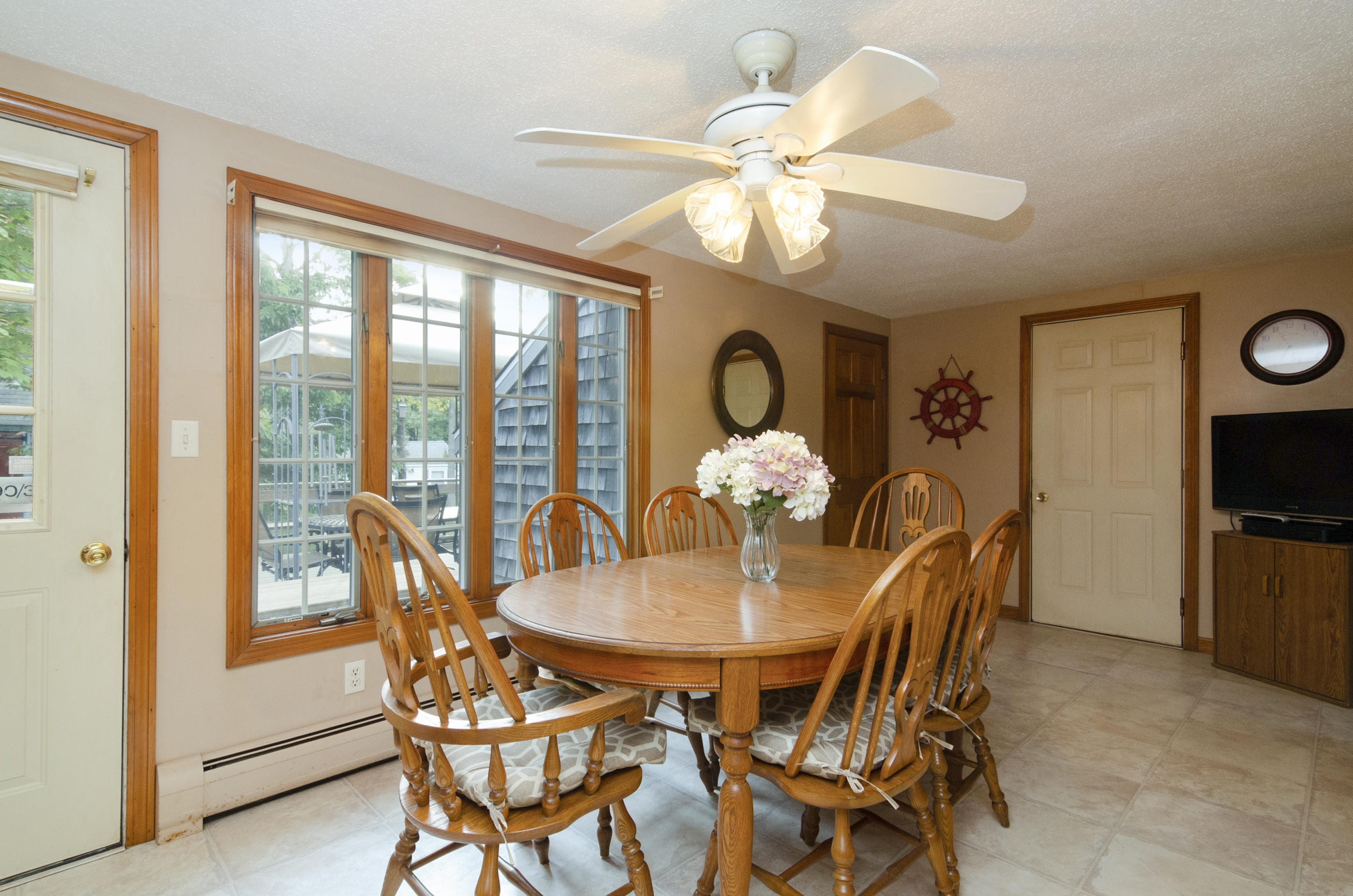 23 Skippers Way Brewster, MA 02631 - Photo 6 of 27 a view of a dining room with furniture window and outside view
