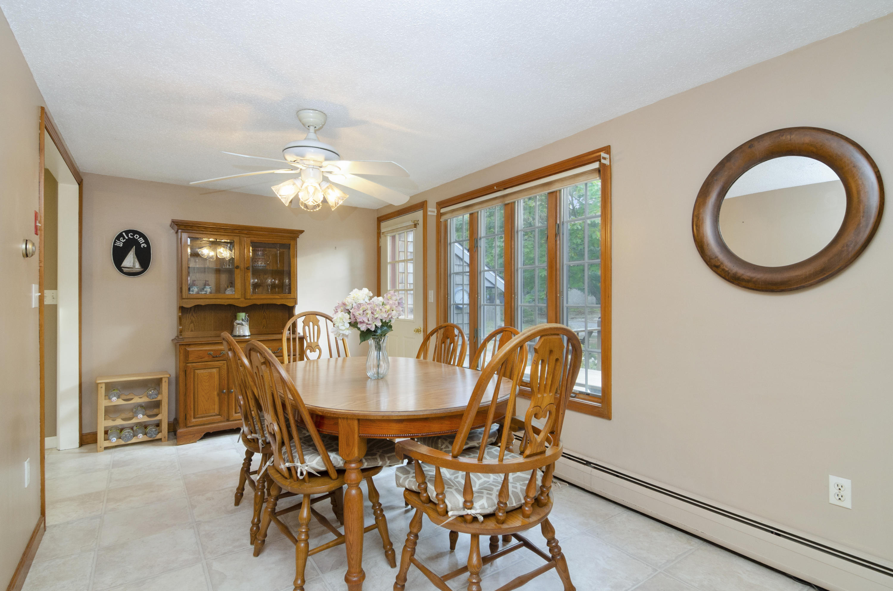 23 Skippers Way Brewster, MA 02631 - Photo 7 of 27 a view of a dining room with furniture and chandelier