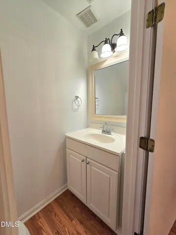 a bathroom with a sink and mirror