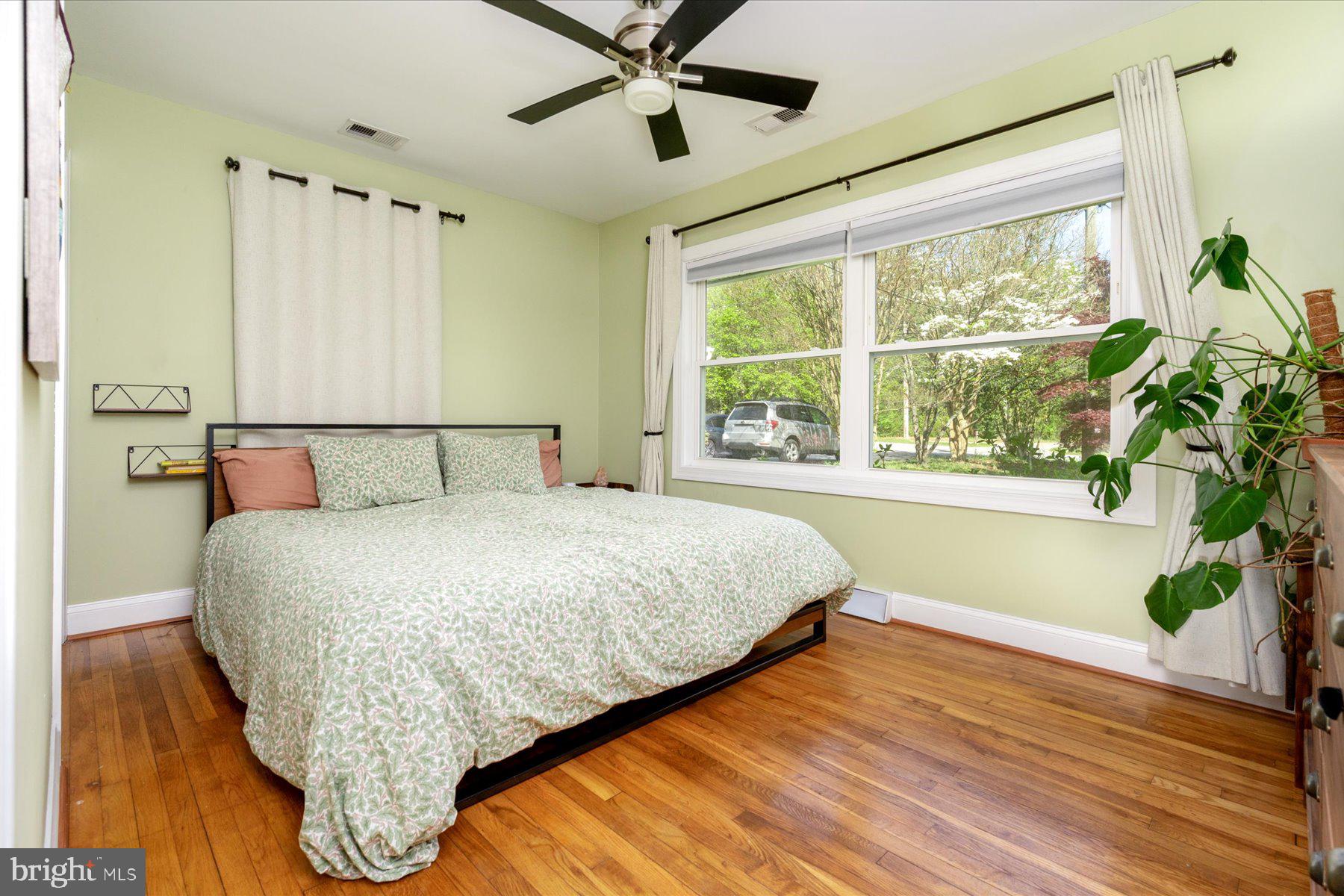 213 Old Magothy Bridge Road Pasadena, MD 21122 - Photo 14 of 31 a bedroom with a large bed and a large window