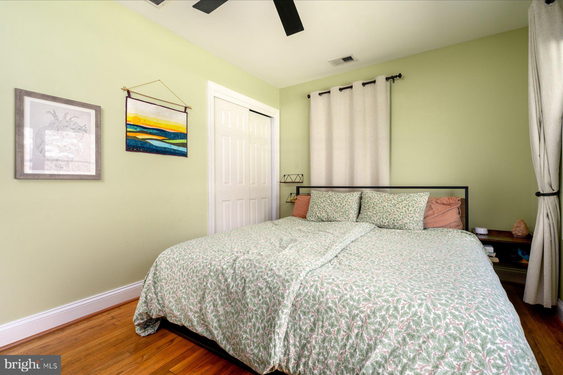 213 Old Magothy Bridge Road Pasadena, MD 21122 - Photo 15 of 31 a bedroom with a bed and wooden floor