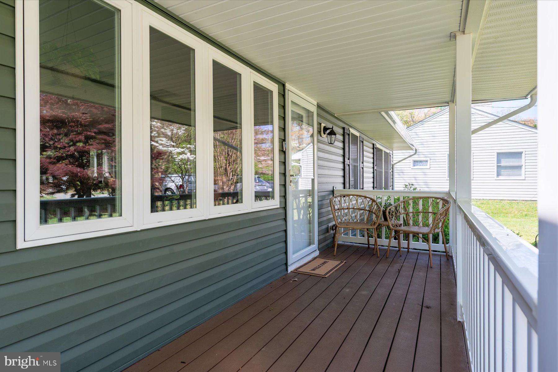 213 Old Magothy Bridge Road Pasadena, MD 21122 - Photo 2 of 31 a balcony with furniture and wooden floor