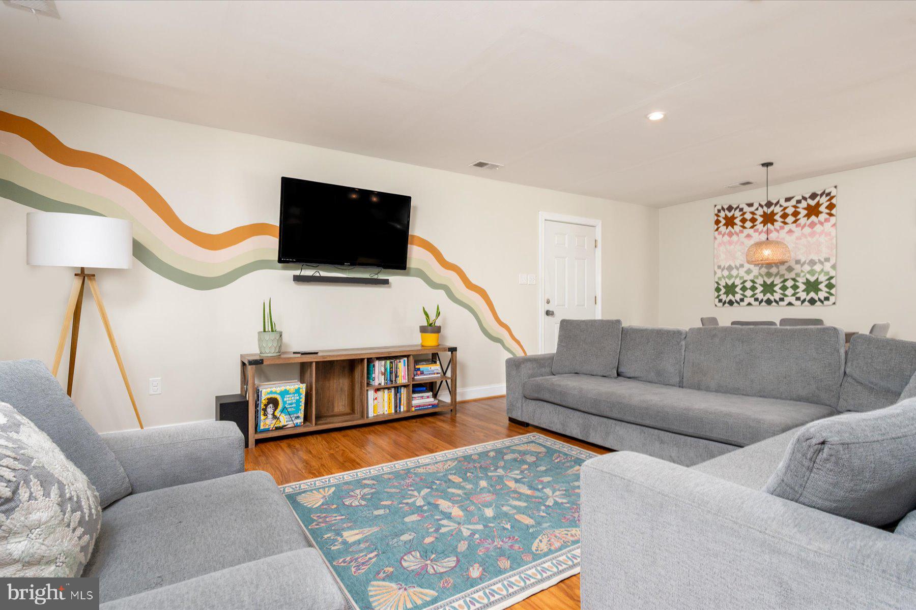 213 Old Magothy Bridge Road Pasadena, MD 21122 - Photo 5 of 31 a living room with furniture and a flat screen tv